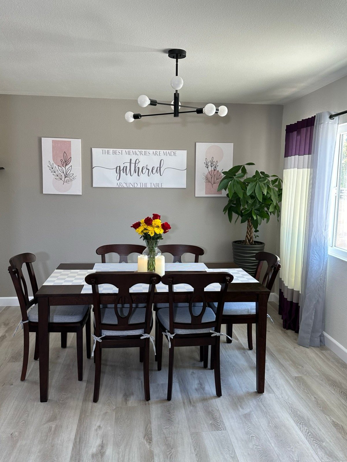 Dining room with a table for six and fresh flowers